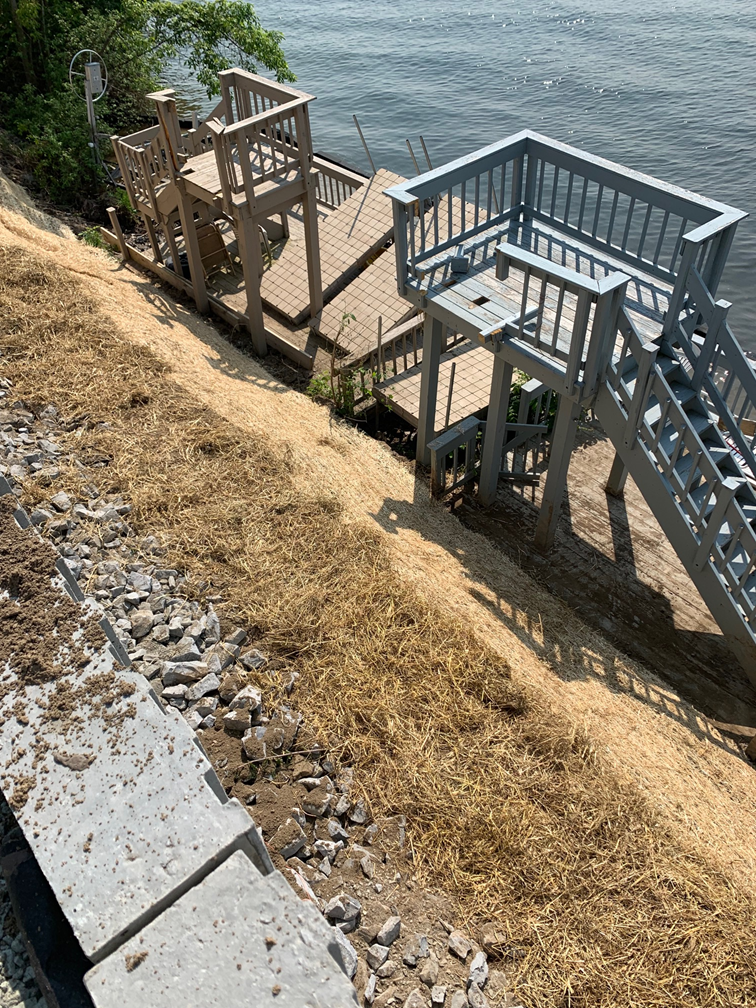 more dug12-foot retaining wall blocking lake access