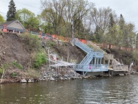 12-foot retaining wall blocking lake access