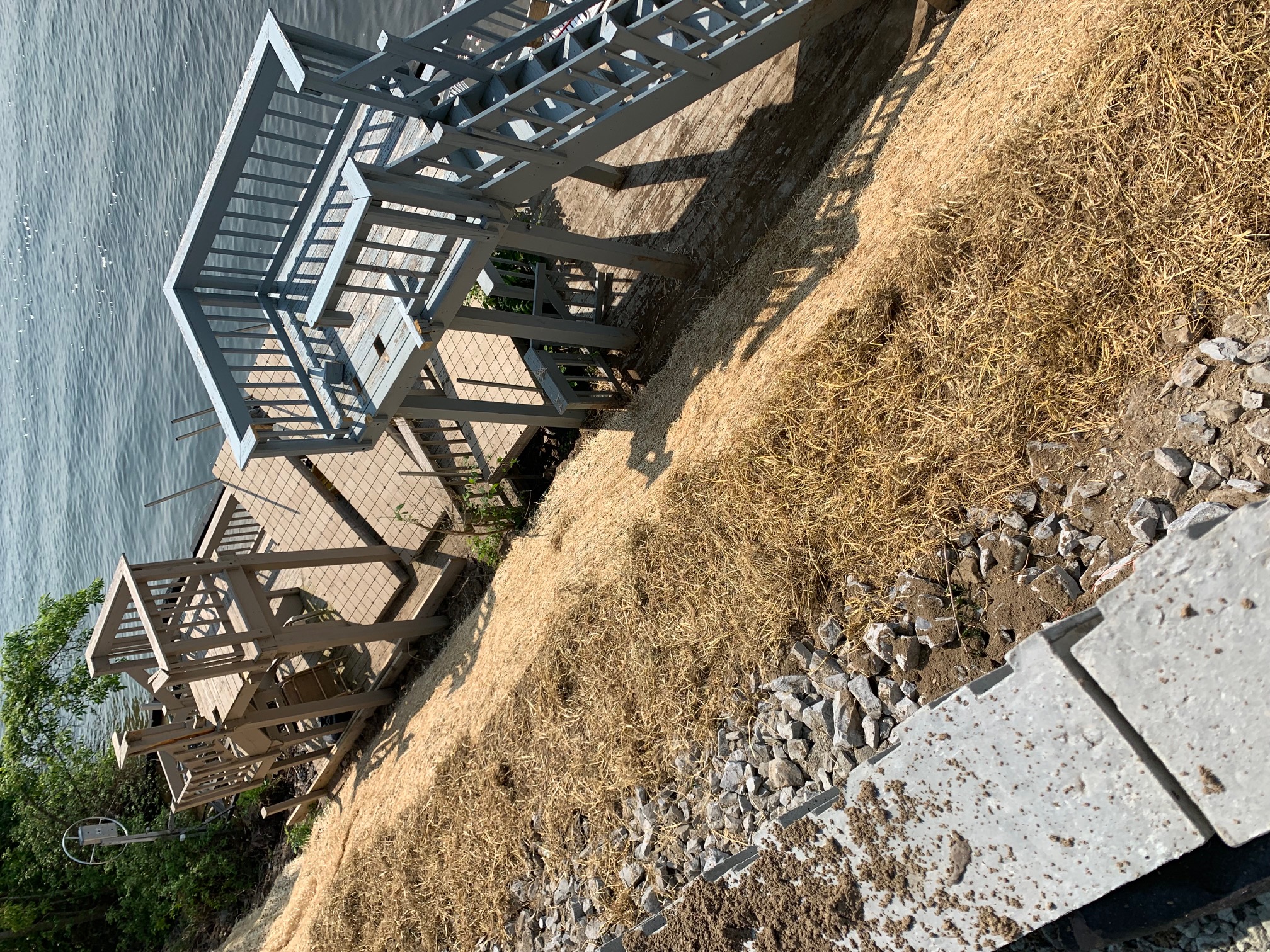 12-foot retaining wall blocking lake access