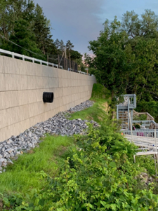 12-foot retaining wall blocking lake access